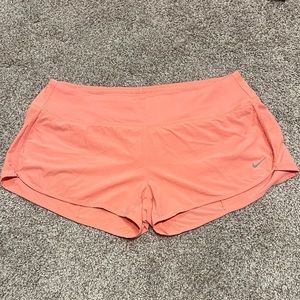 Light coral Nike running shorts